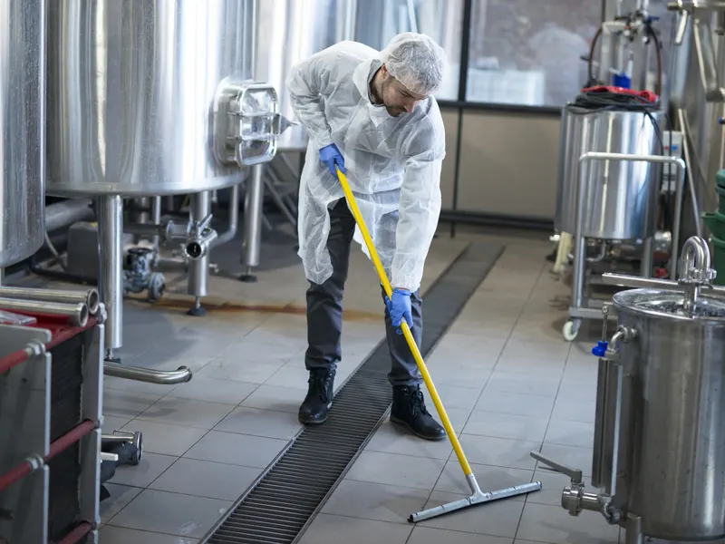 Cleaner mopping the floor of a Perth workplace